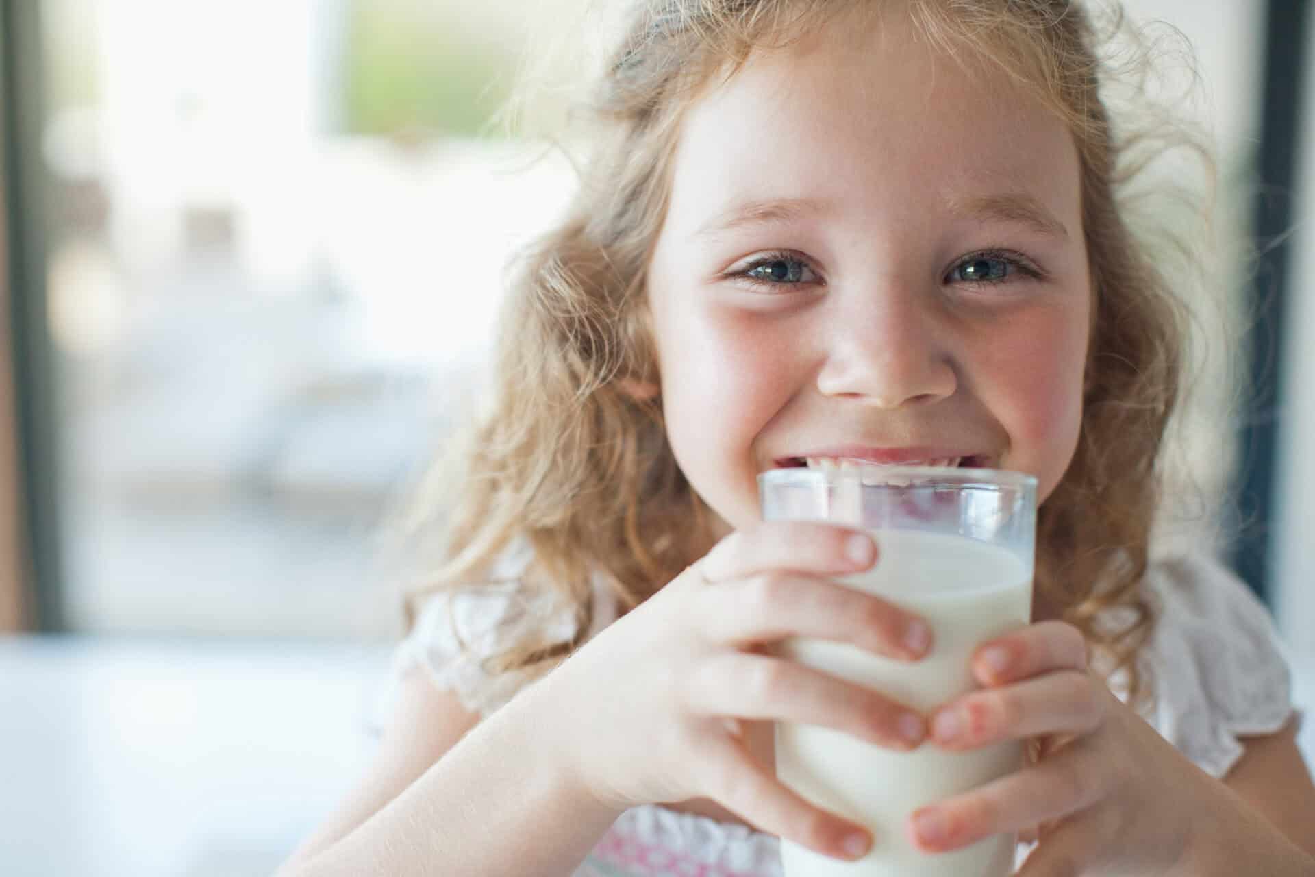 Girl drinking glass of milk